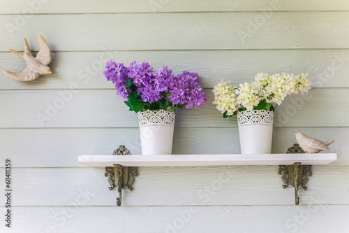 colorful flowers in pots vintage on wall