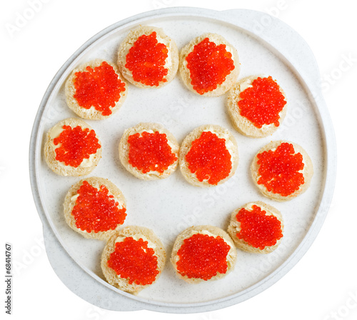 sandwich with red caviar on a tray isolated on white background