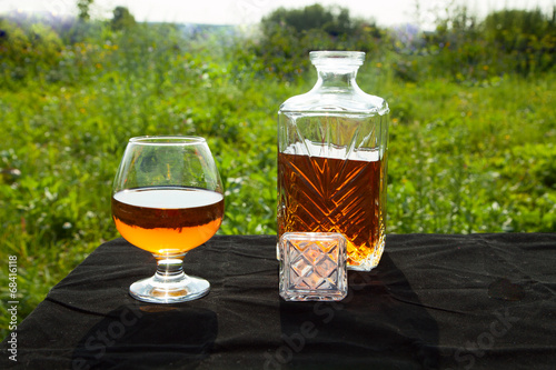 Bottle with a glass of brandy photo