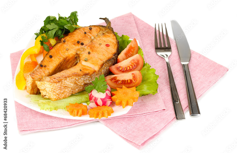 Appetizing grilled salmon with lemon and vegetables isolated Appetizing grilled salmon with lemon and vegetables isolated