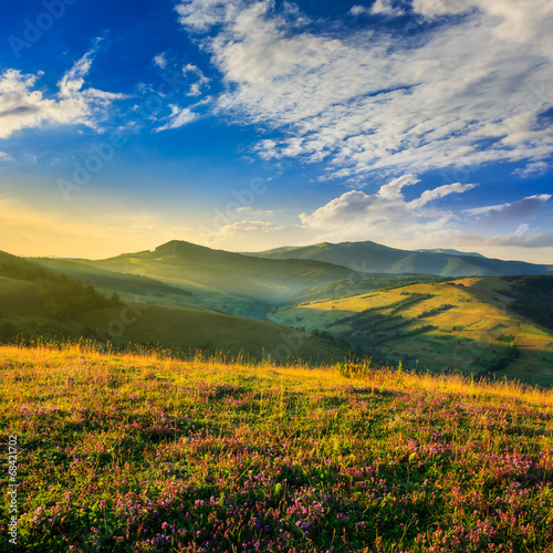 cold fog on hot sunrise in mountains © Pellinni