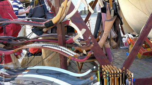 Lots of bows and arrows displayed on the street  GH4 4K UHD photo