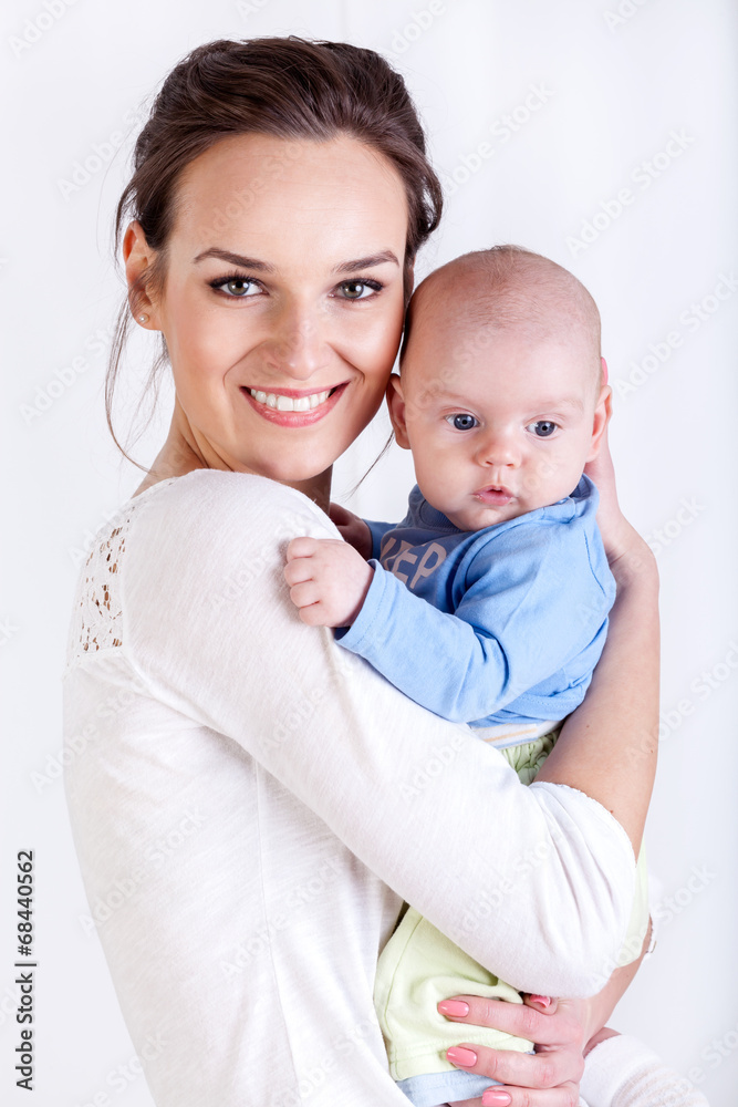 Young mother holding her baby Young mother holding her baby