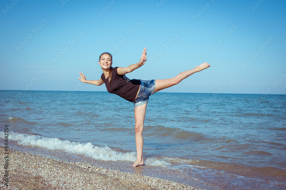 Young cheerful girl on the sea Young cheerful girl on the sea
