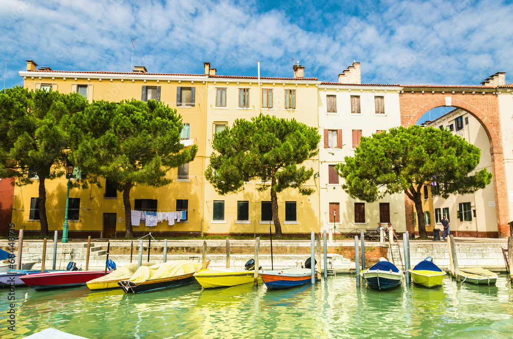 Venice landmark, colorful houses and boats, Italy.