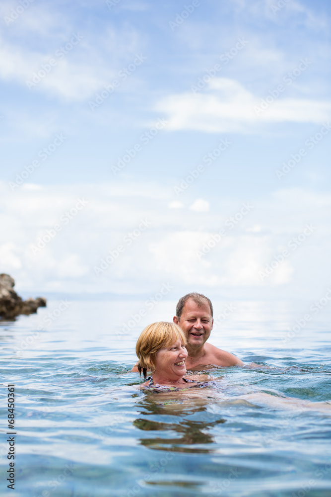 Senior couple enjoying the retirement on a seacost