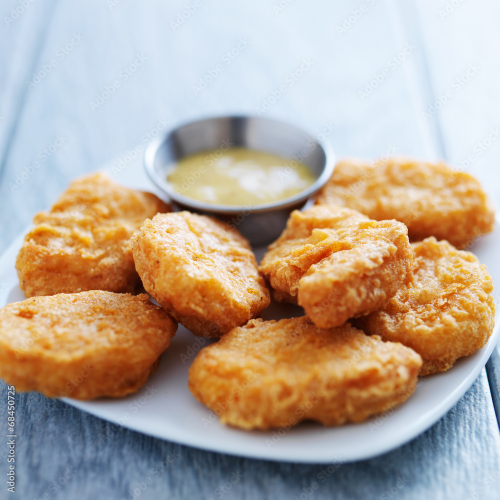 chicken nuggets with honey mustard in natural light