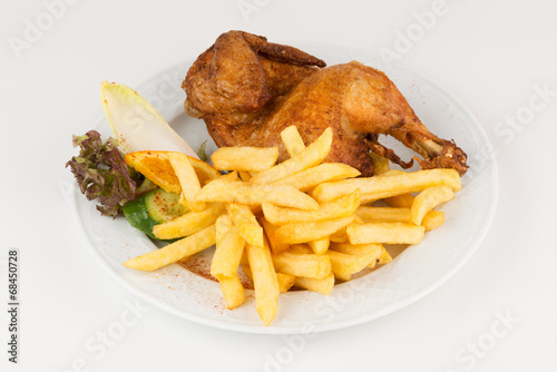 Halbes Hähnchen mit Pommes photo