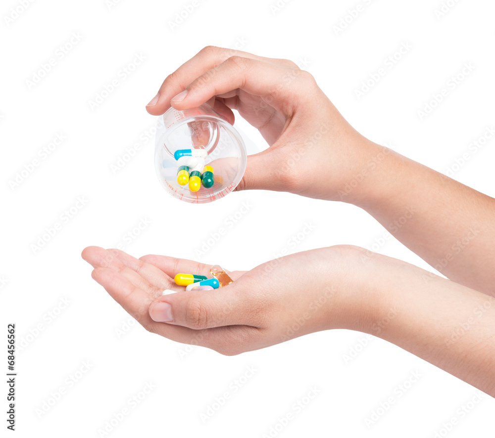Fototapeta premium Druge capsules and pills in hand