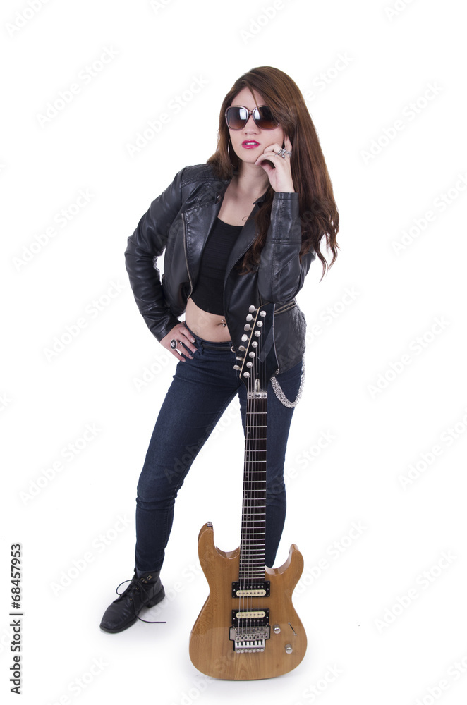 Beautiful rebel young girl posing with electric guitar Beautiful rebel young girl posing with electric guitar