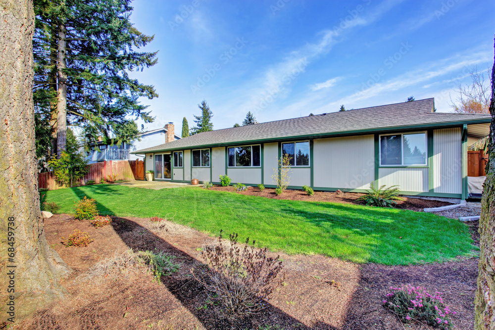 House exterior. Backyard with walkout deck House exterior. Backyard with walkout deck