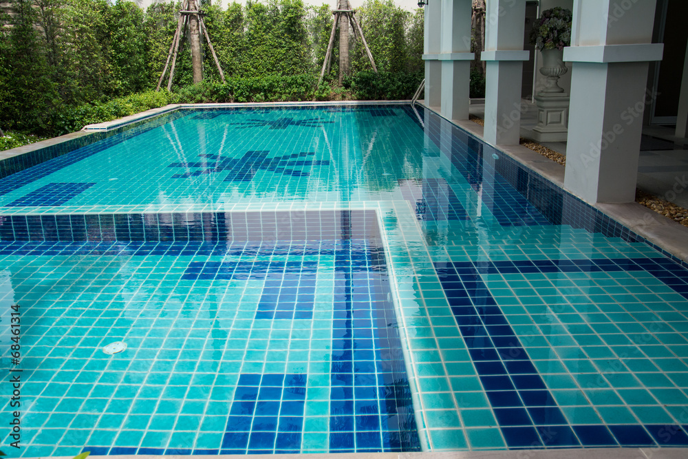 Residential swimming pool in backyard