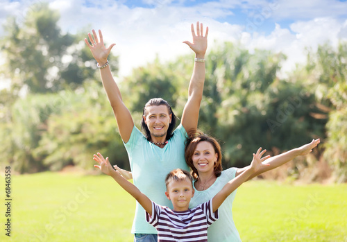 Portrait of happy family of three