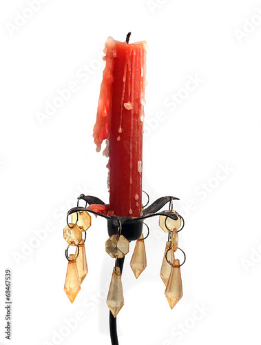 red candle wax on a solid metal candlestick