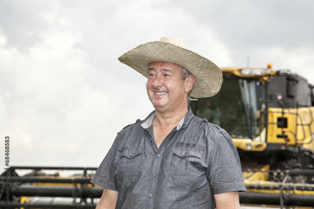 Farmer with combine harvester