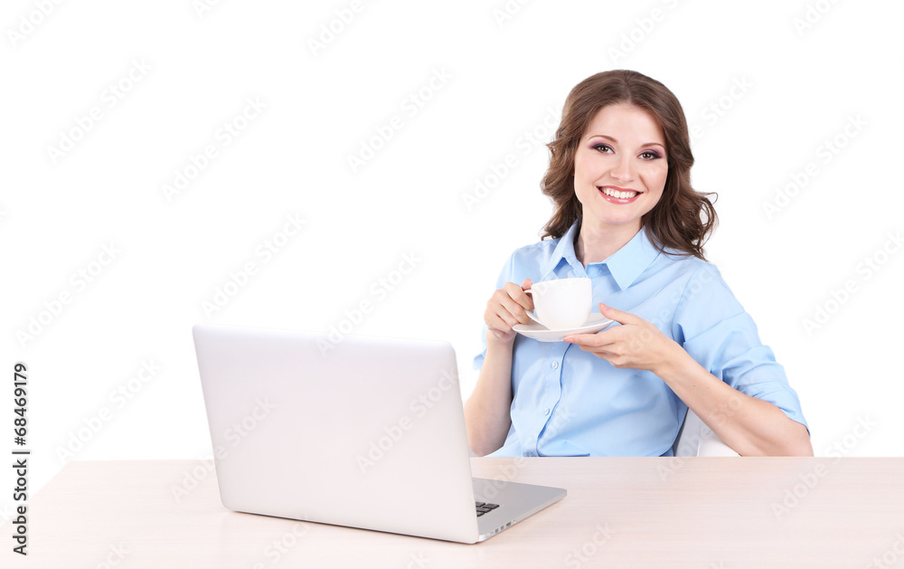 Young business woman sitting at table with notebook in room Young business woman sitting at table with notebook in room