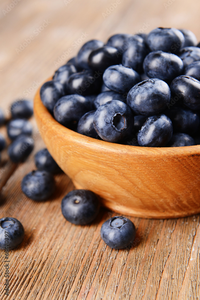 Delicious blueberries in bowl on table close-up Delicious blueberries in bowl on table close-up