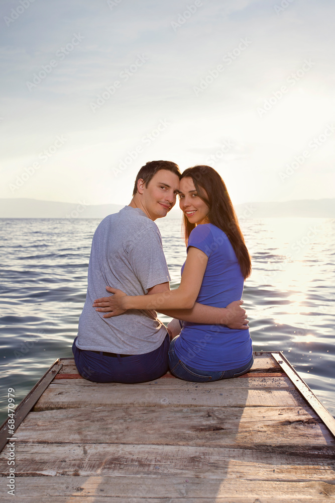 Young couple watching sunset