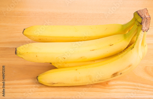 Bunch of Yellow Bananas on Wood Table