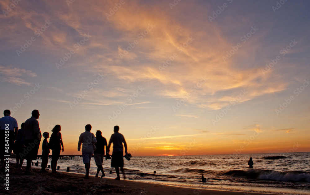 Group of friends watching the sunset