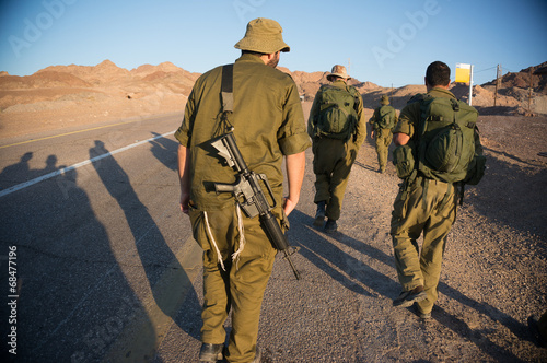 Soldiers patrol in desert