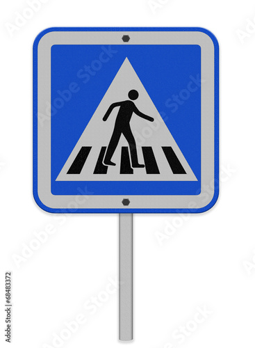 crosswalk sign with a man walking on yellow