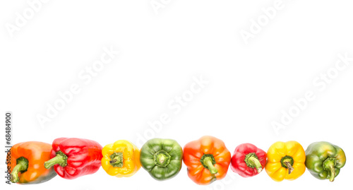 A group of different colors of capsicum over white background