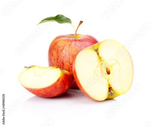 Close-up shot sliced red apple with leaf isolated