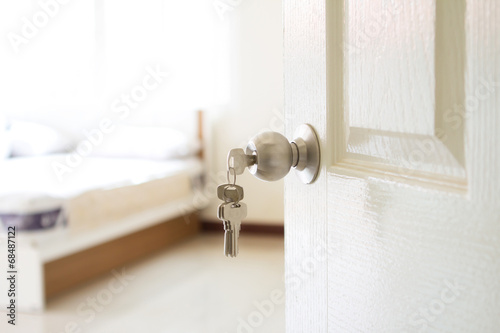 opened bedroom door with the key © Cozine
