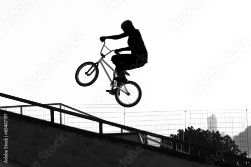 Fototapeta Naklejka Na Ścianę i Meble -  BMX - Girl jumping with bike