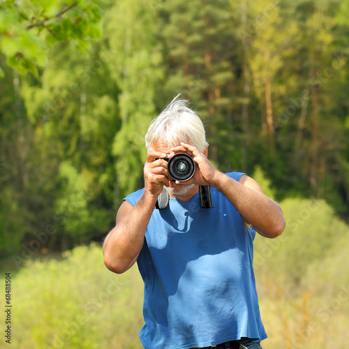 old photographer photographs. 