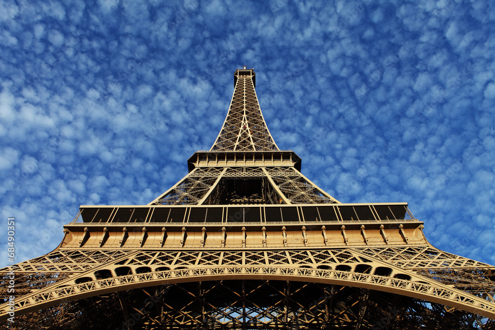 Eiffel Tower in Paris on the winter with the white clouds