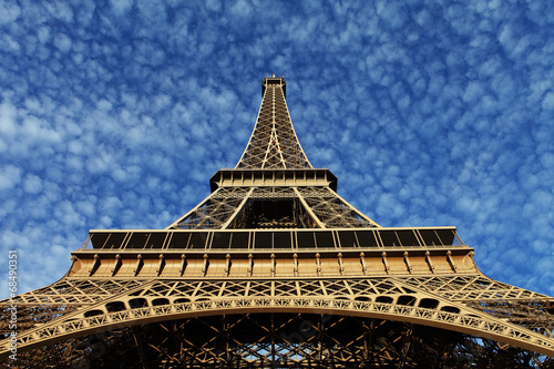 Eiffel Tower in Paris on the winter with the white clouds © danmir12