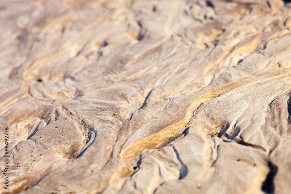 Sand surface with the relief formed by water currents Sand surface with the relief formed by water currents