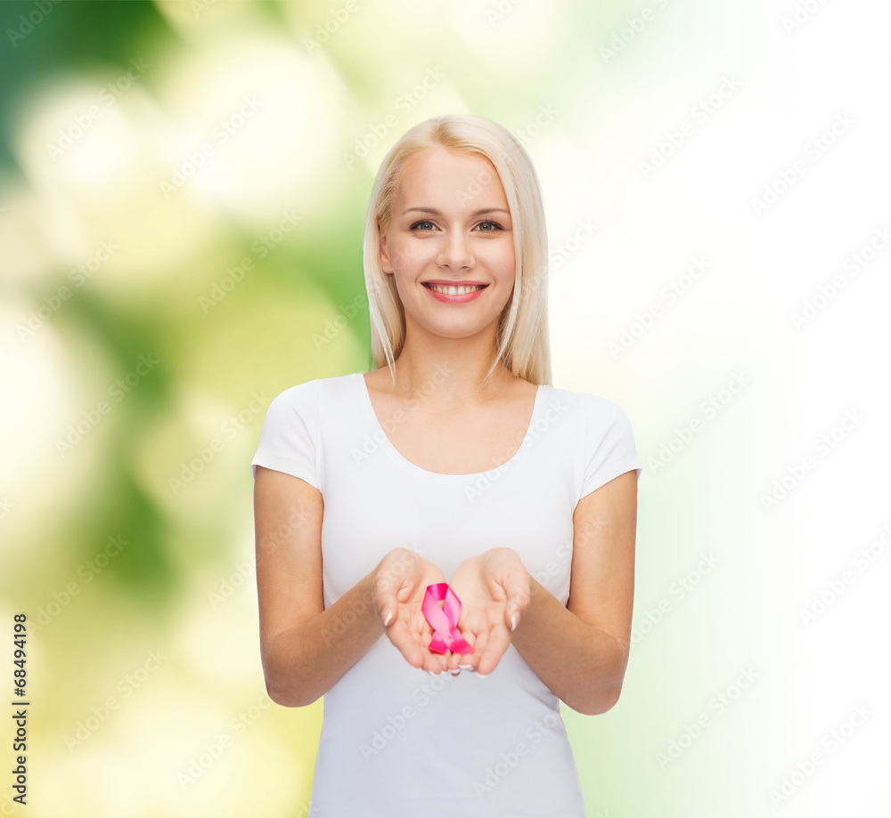 woman holding pink cancer awareness ribbon