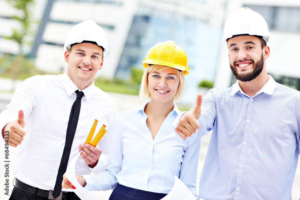 Group of happy architects on site Group of happy architects on site