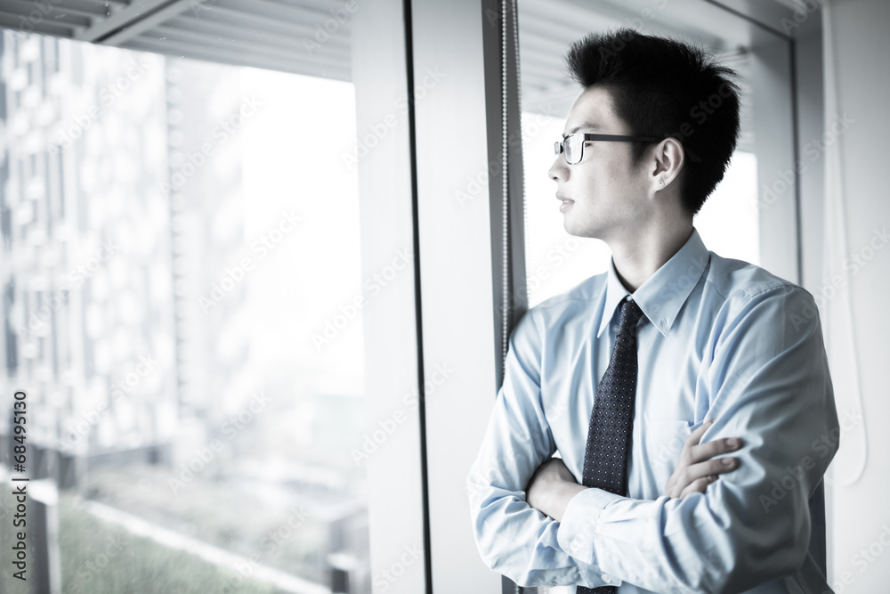 Portrait of a businessman looking at the window