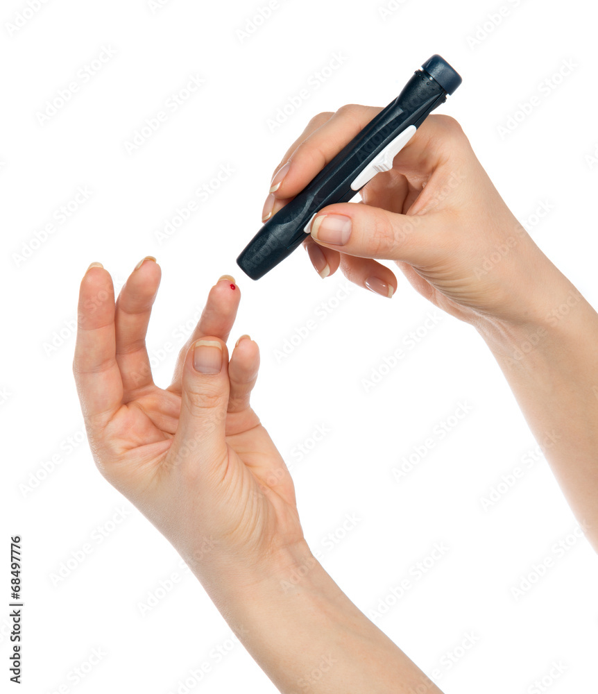 Diabetes lancet in hand prick finger to make punctures Diabetes lancet in hand prick finger to make punctures