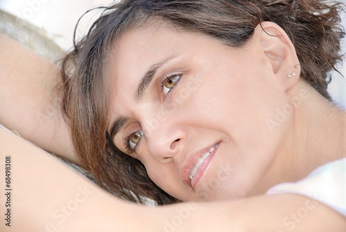 face of young woman lying and carefree photo