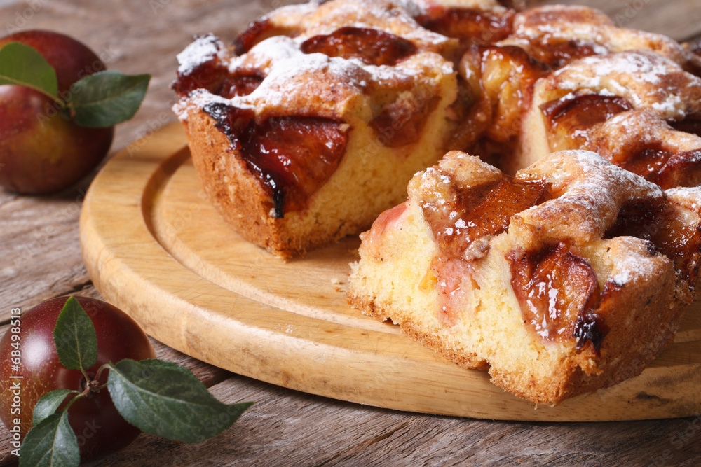 sliced plum cake close up on chopping board horizontal sliced plum cake close up on chopping board horizontal