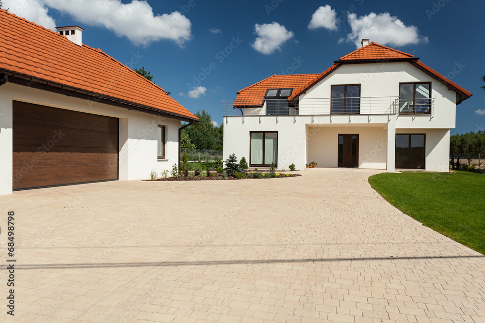 Modern house and outbuilding with garage
