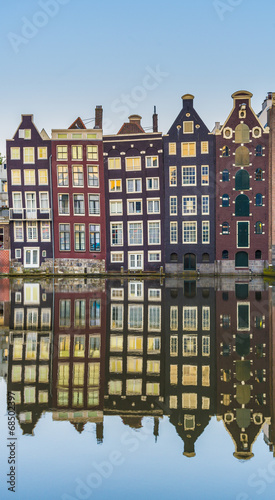 Photography The Damrak canal in Amsterdam, Netherlands.