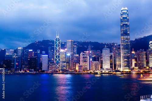 Hong Kong city skyline at night over Victoria Harbor © zhangyang135769