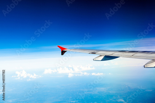 Classic image through aircraft window onto jet engine
