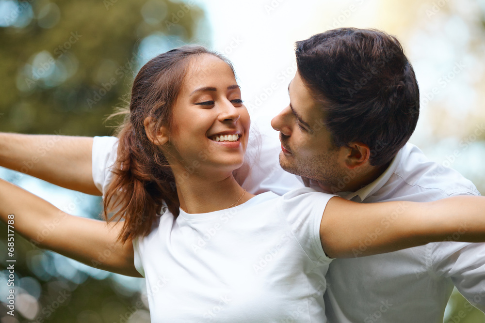 Young Happy Couple Hugging and Laughing. Young Happy Couple Hugging and Laughing.