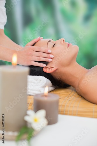 Beautiful brunette enjoying a head massage