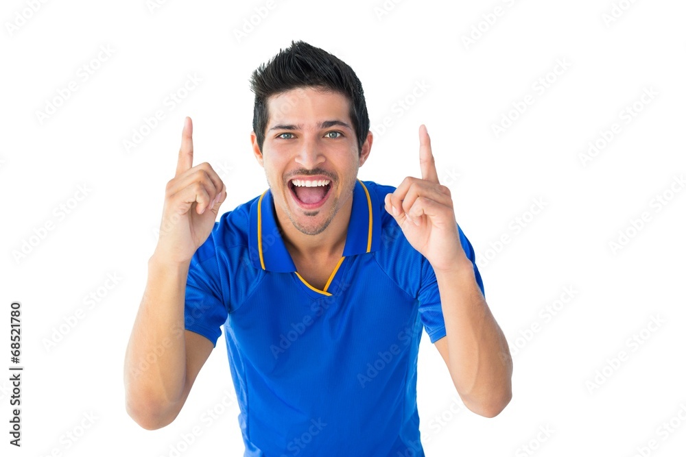 Happy football player in blue celebrating
