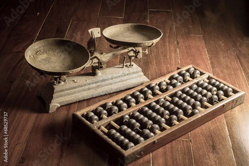 Ancient business tools,old scale and abacus photo