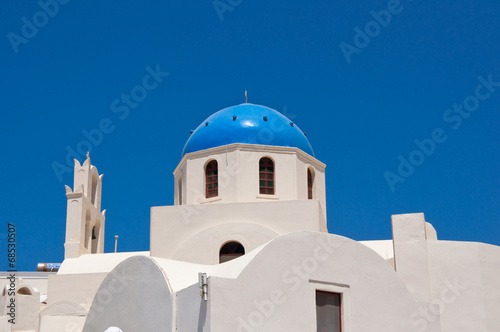 Oia church with blue cupola on the island of Santorini, Greece.