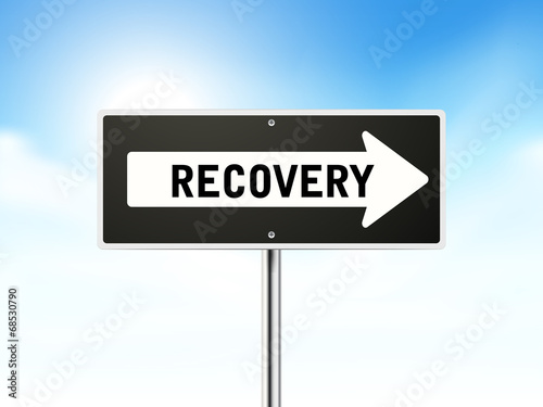 recovery on black road sign